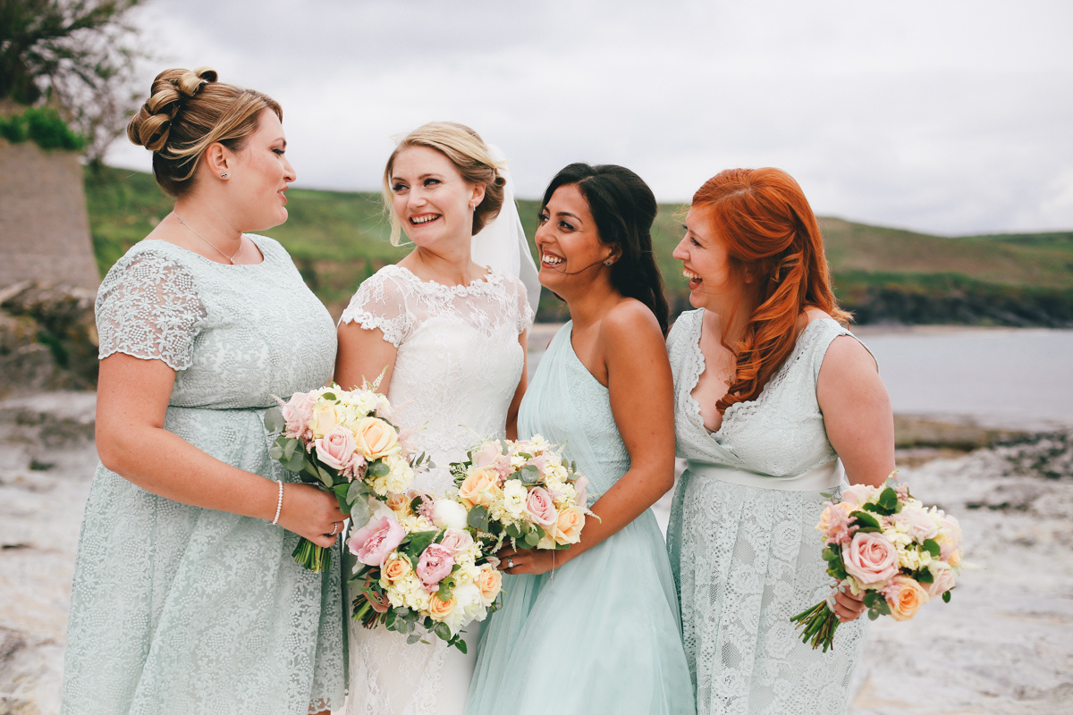 Group shot at Prussia Cove, Cornwall wedding by Love Oh Love Photography