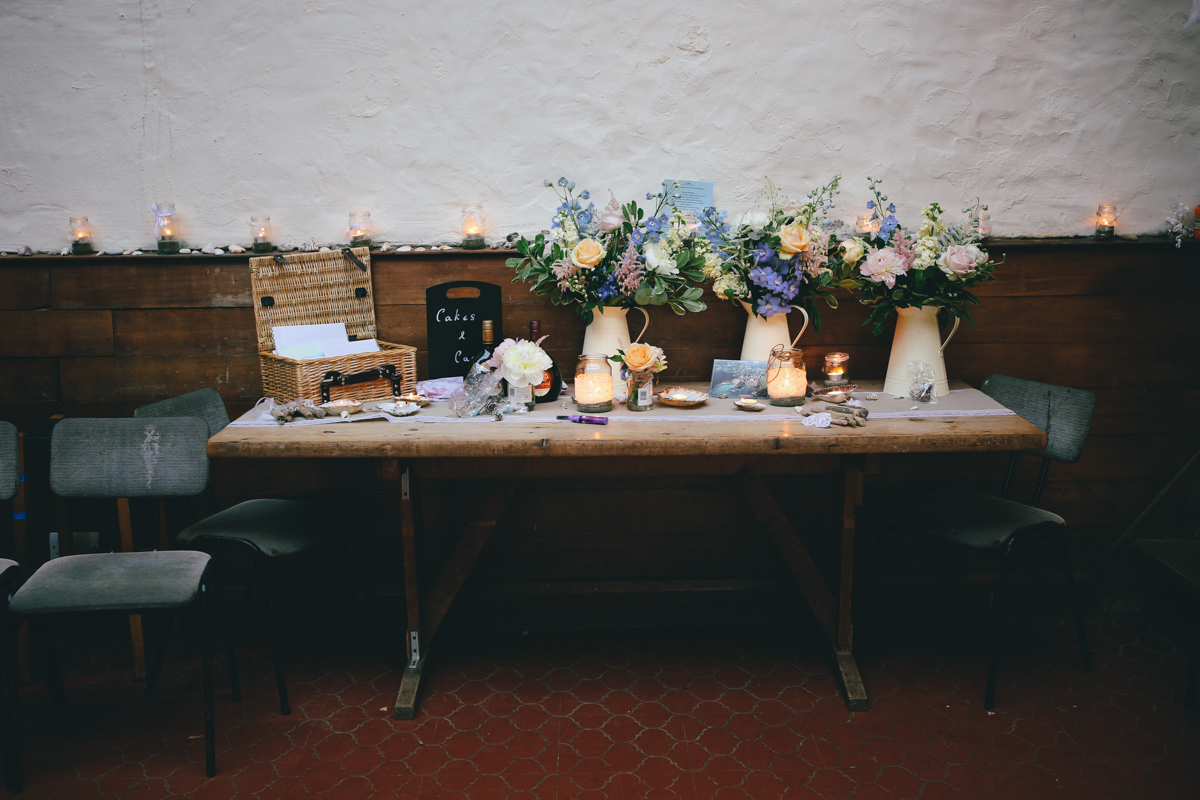 Table decorations at Prussia Cove, Cornwall wedding by Love Oh Love Photography