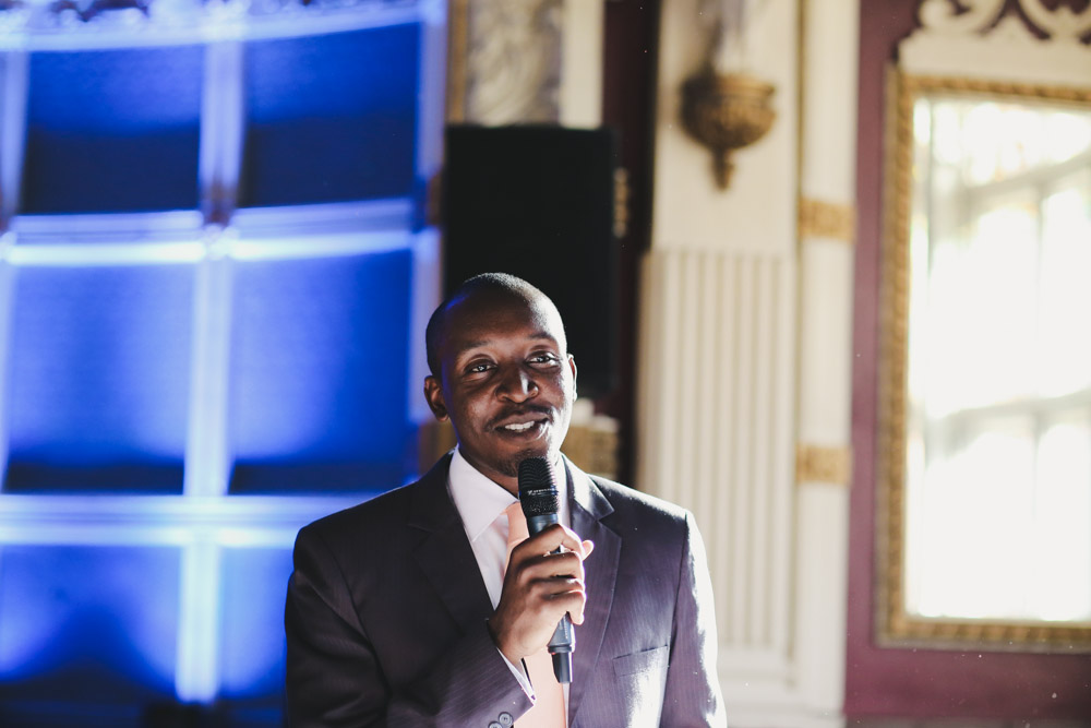 groom laughing at wedding reception wedding speech at Old Finsbury Town Hall Guest at Old Finsbury Town Hall, London by Love oh Love photography
